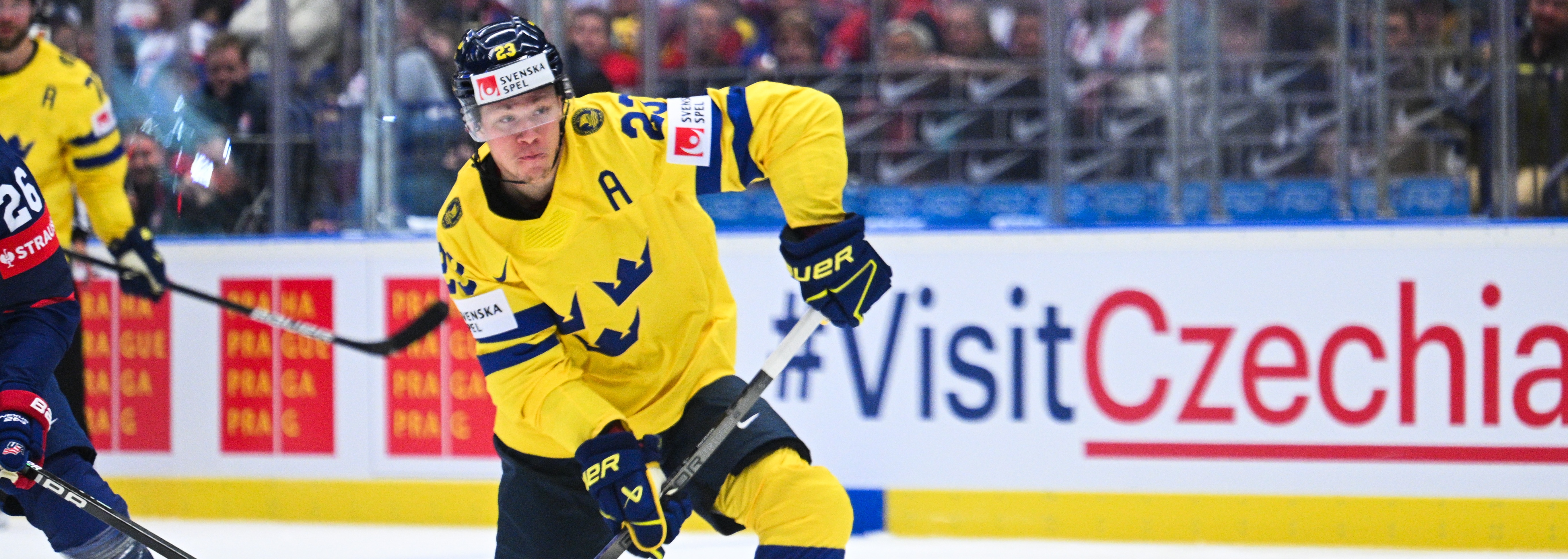 Bild av en svensk ishockeyspelare i gul Tre Kronor-dress Bild av en svensk ishockeyspelare i gul Tre Kronor-dress