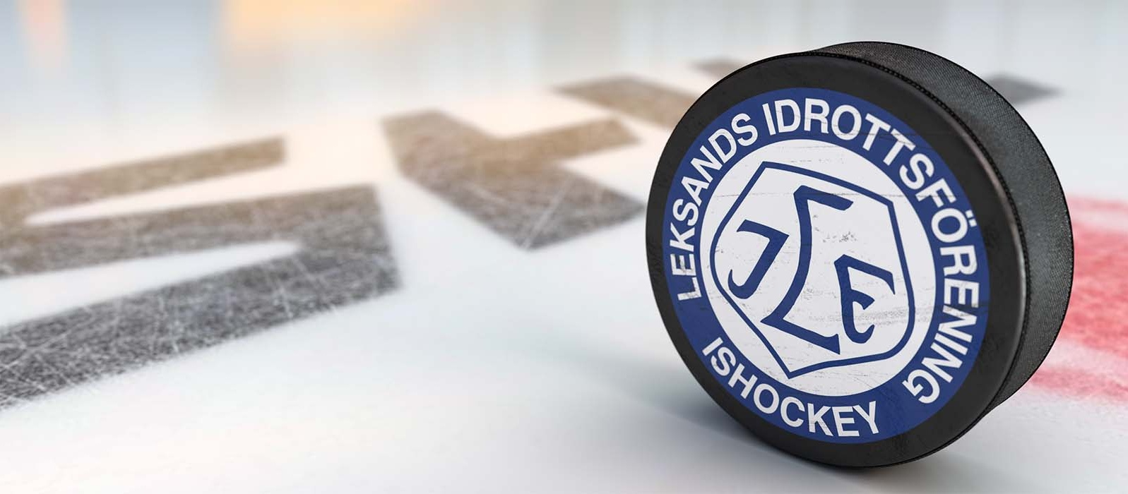 Bild med puck med Leksands logga