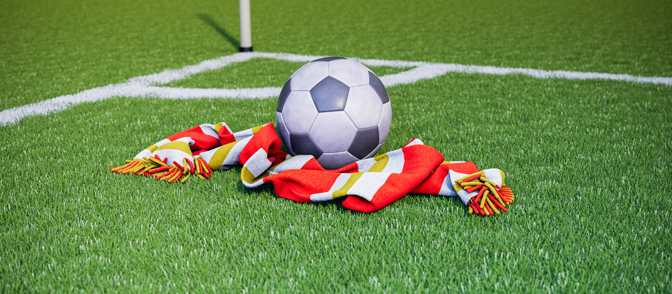 Bild på en fotboll och en supporterhalsduk med allsvenska laget Degerfors IF:s färger