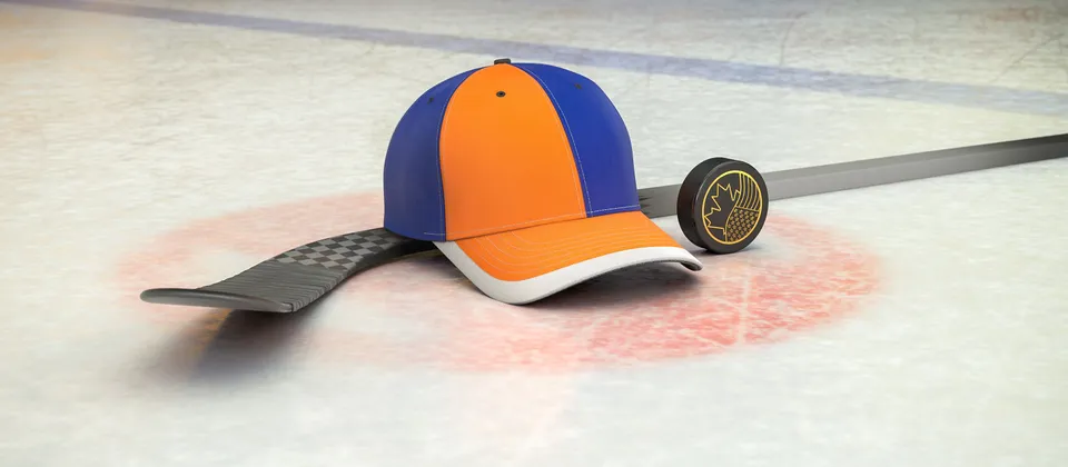 Bild på hockeyklubba, puck och en supporterkeps med NHL-laget New York Islanders färger
