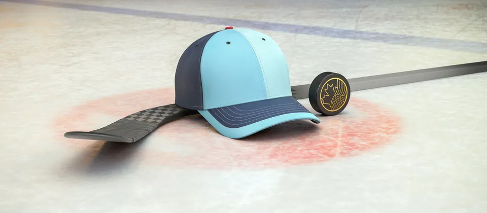 Bild på hockeyklubba, puck och en supporterkeps med NHL-laget Seattle Krakens färger