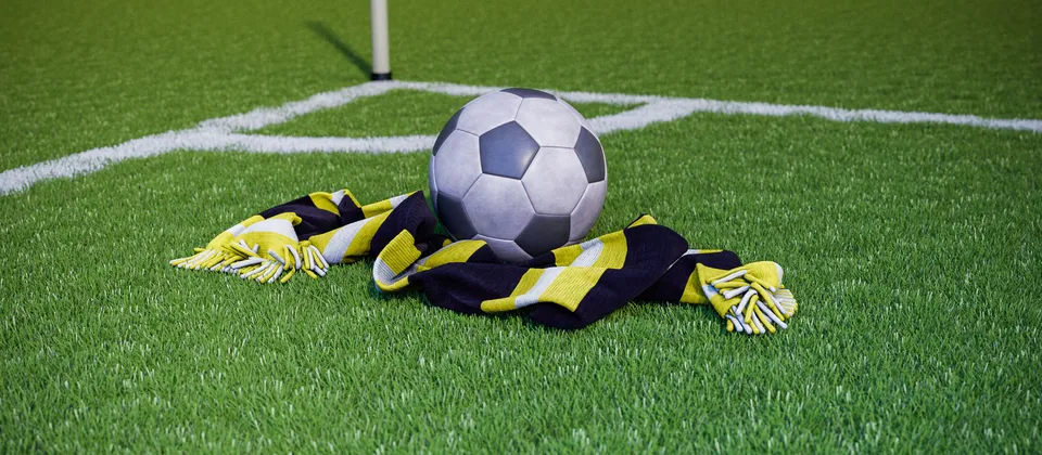 Bild på en fotboll och en supporterhalsduk med allsvenska laget Häckens färger