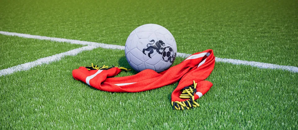 Bild på en fotboll och en supporterhalsduk med Premier League-laget Manchester Uniteds färger