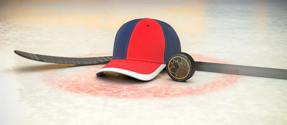 Bild på hockeyklubba, puck och en supporterkeps med NHL-laget Washington Capitals färger