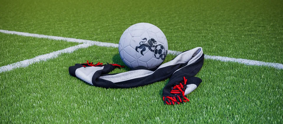 Bild på en fotboll och en supporterhalsduk med Premier League-laget Fulhams färger
