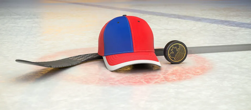 Bild på hockeyklubba, puck och en supporterkeps med NHL-laget New York Rangers färger