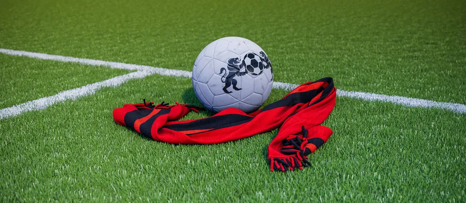 Bild på en fotboll och en supporterhalsduk med Premier League-laget Bournemouths färger
