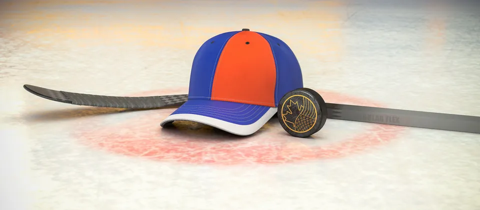 Bild på hockeyklubba, puck och en supporterkeps med NHL-laget Edmonton Oilers färger