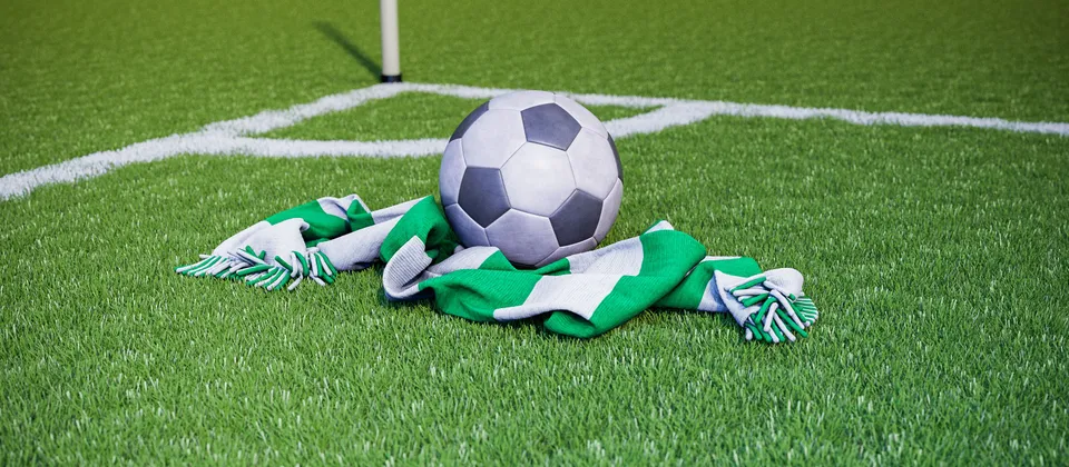 Bild på en fotboll och en supporterhalsduk med allsvenska laget Hammarbys färger