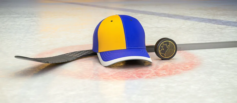 Bild på hockeyklubba, puck och en supporterkeps med NHL-laget St. Louis Blues färger