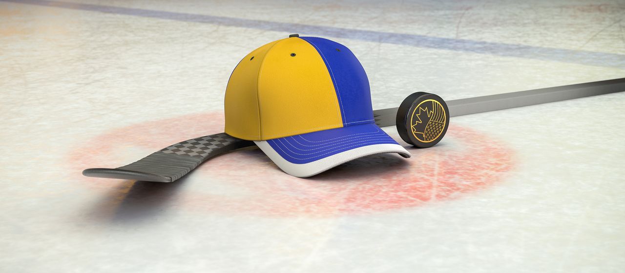 Bild på hockeyklubba, puck och en supporterkeps med NHL-laget Buffalo Sabres färger